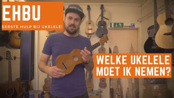 Man houdt ukelele vast
